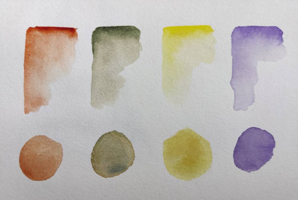 Quatre essais de couleur : orange, vert, jaune, violet