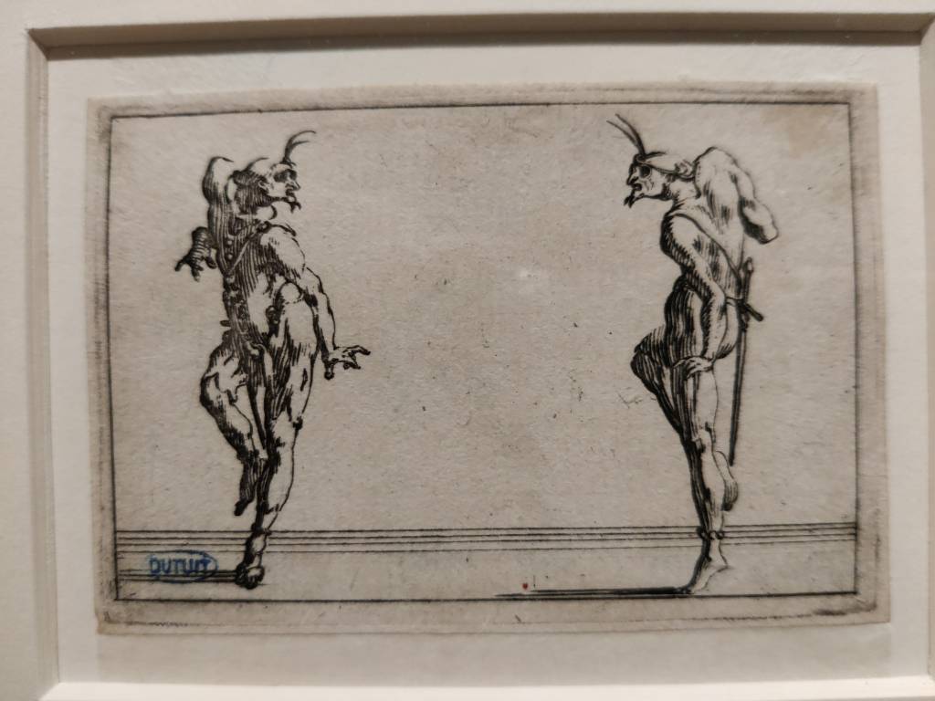 Dessin noir de deux personnages caricaturaux dansant