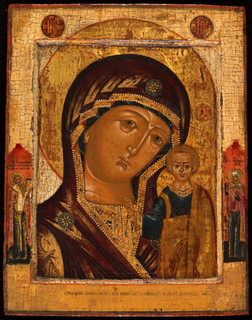 Icône dont le cadre est décoré de personnage représentant la Vierge et l'enfant